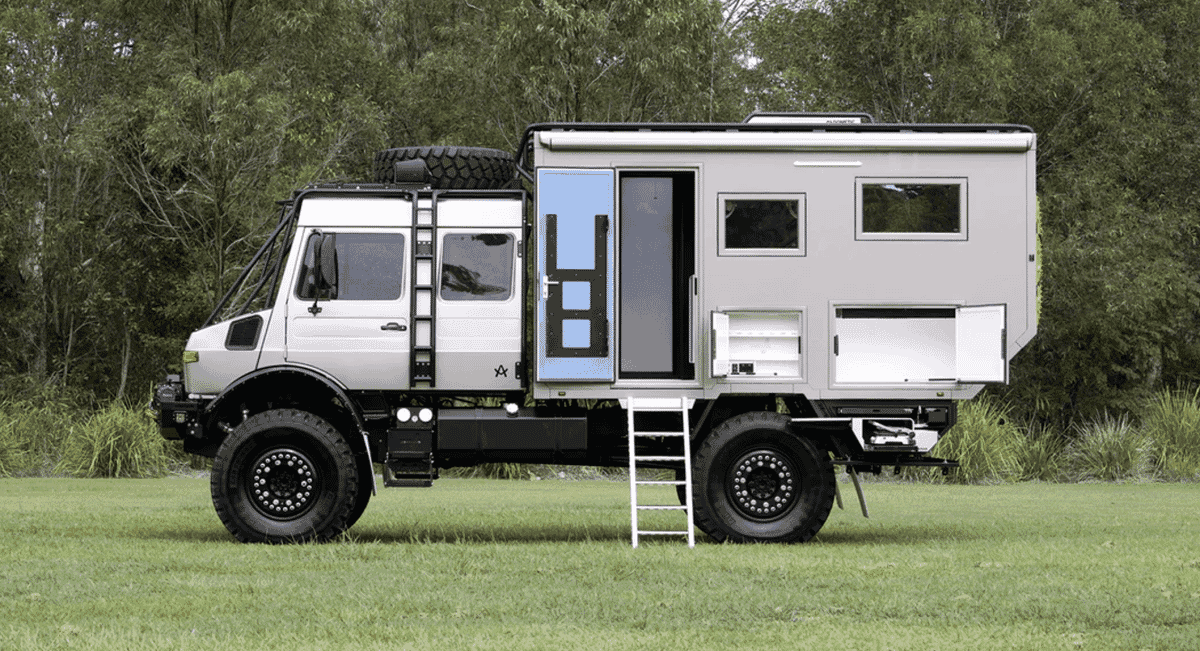 The Arksen U1700 parked on a grassy field with its pop-up roof and living extension visible.