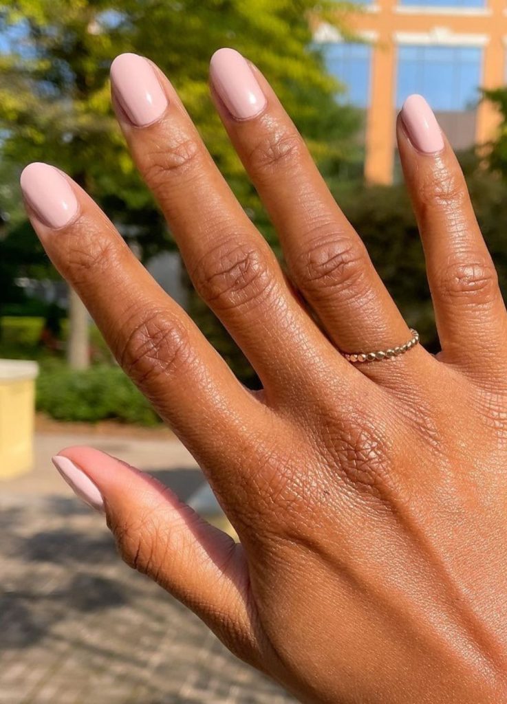 Soft ballet pink manicure with a translucent finish.