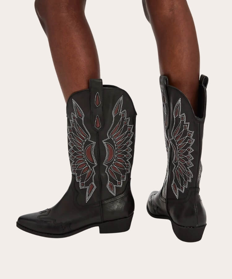 Matisse embroidered western boots with intricate white stitching on black leather.