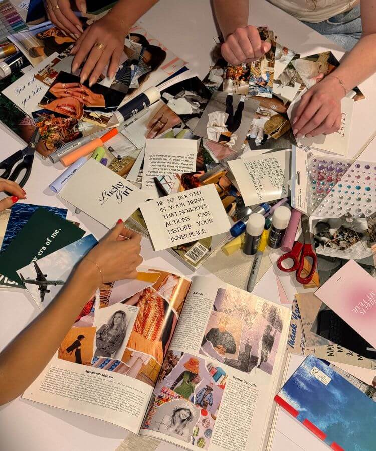 A woman curating an aesthetic vision board with photos and quotes