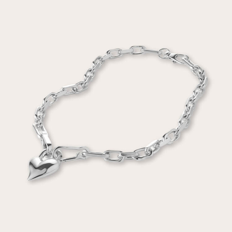 Jenny Bird Heart Pendant Necklace in silver.