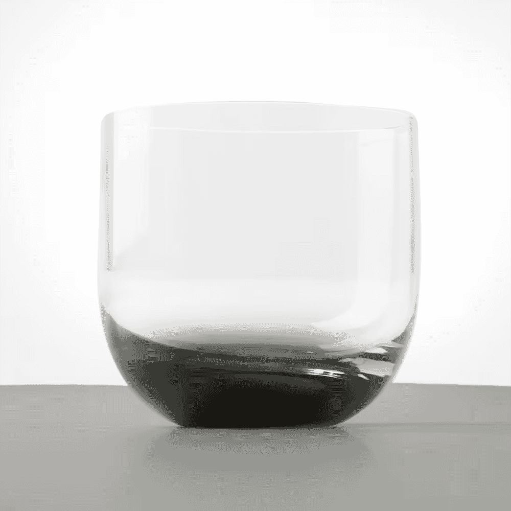 A modern glass tumbler with a dark base showcasing a minimalist aesthetic.