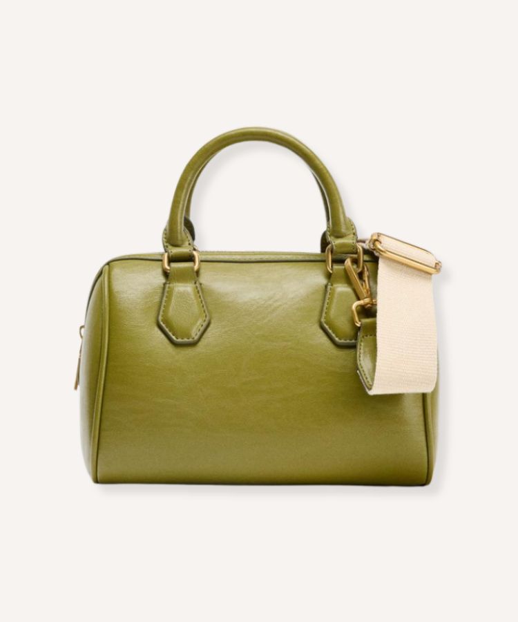 A structured top-handle city bag in a vivid chartreuse leather finish.