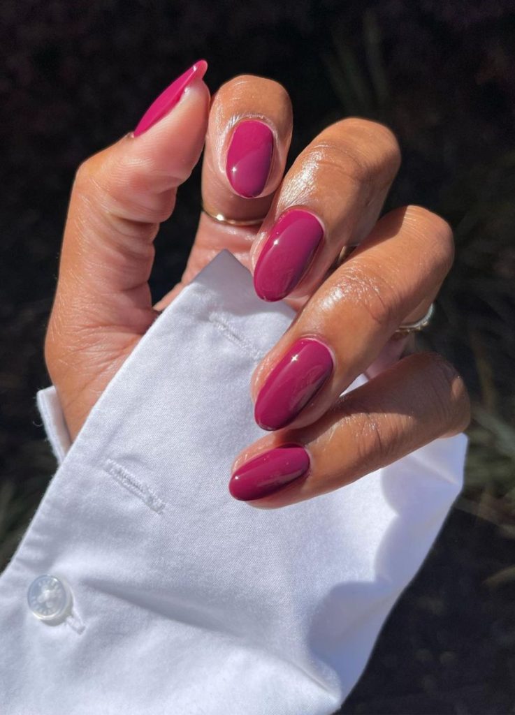 Vibrant raspberry pink-red manicure.