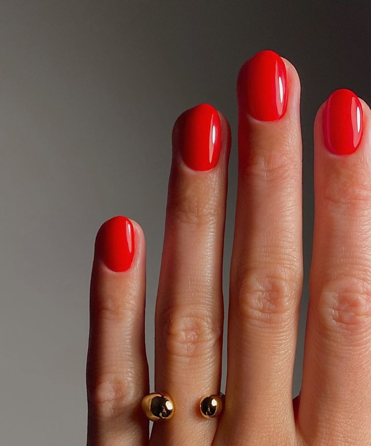 Deep classic red manicure with a high-shine finish.