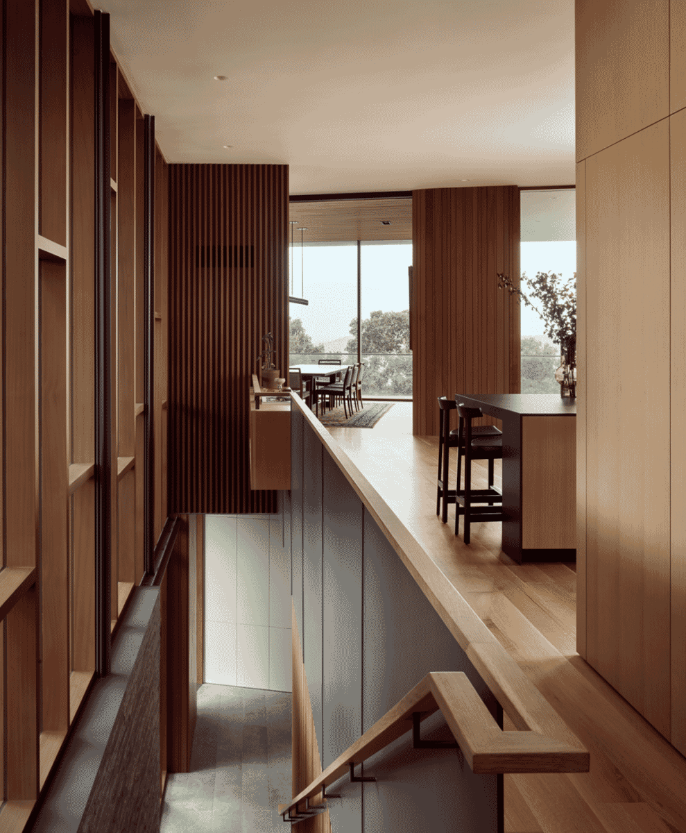 Interior view of a modern kitchen with wooden accents and an open floor plan.