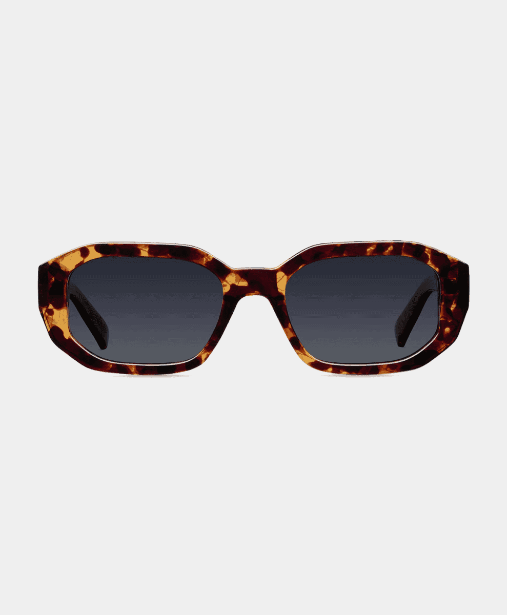 Geometric tortoiseshell frame sunglasses with dark gradient lenses