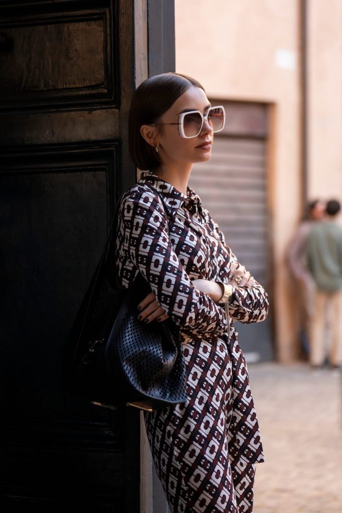 Emily wearing a bold outfit with accessories