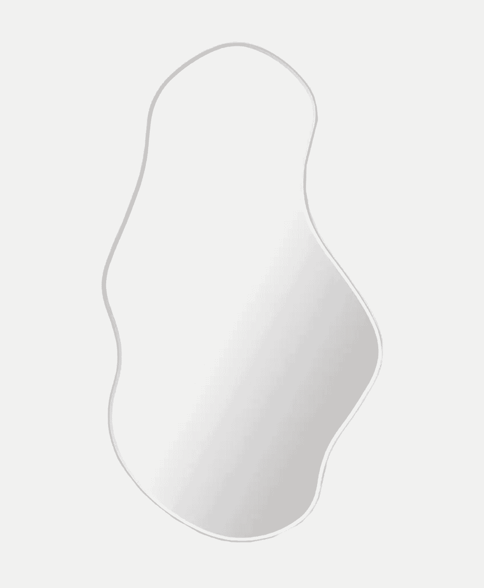 Minimalist wavy-edged wall mirror with a smooth white surface.