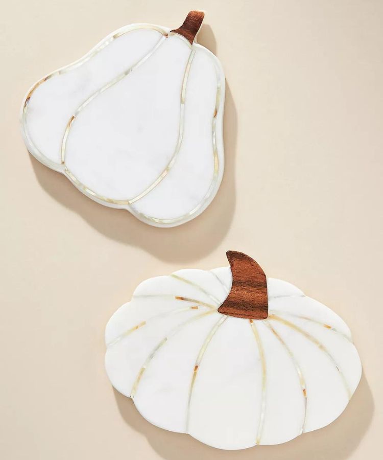Pumpkin-shaped coaster crafted from white and grey marble.