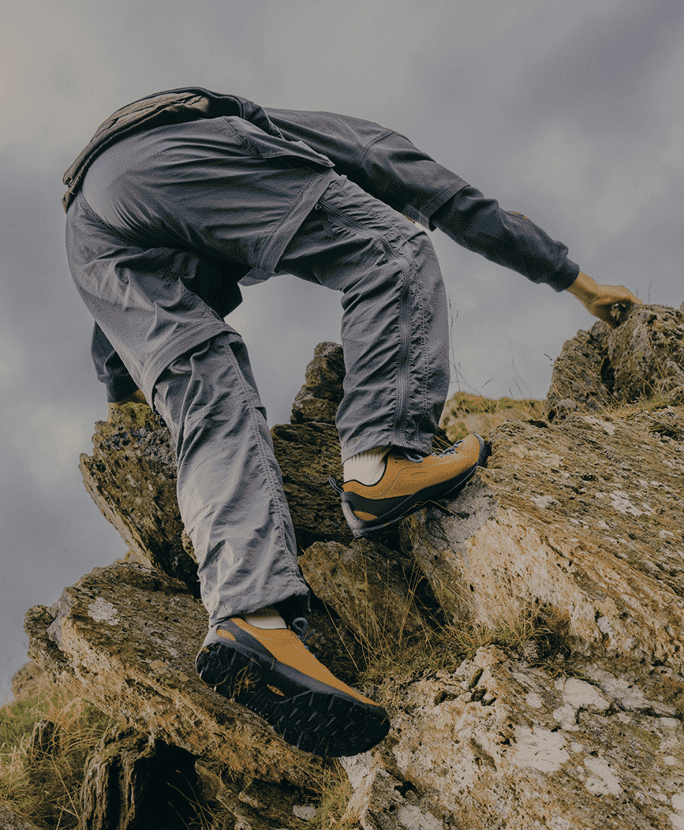 Close-up of KEEN technical boots showing traction and waterproof features.