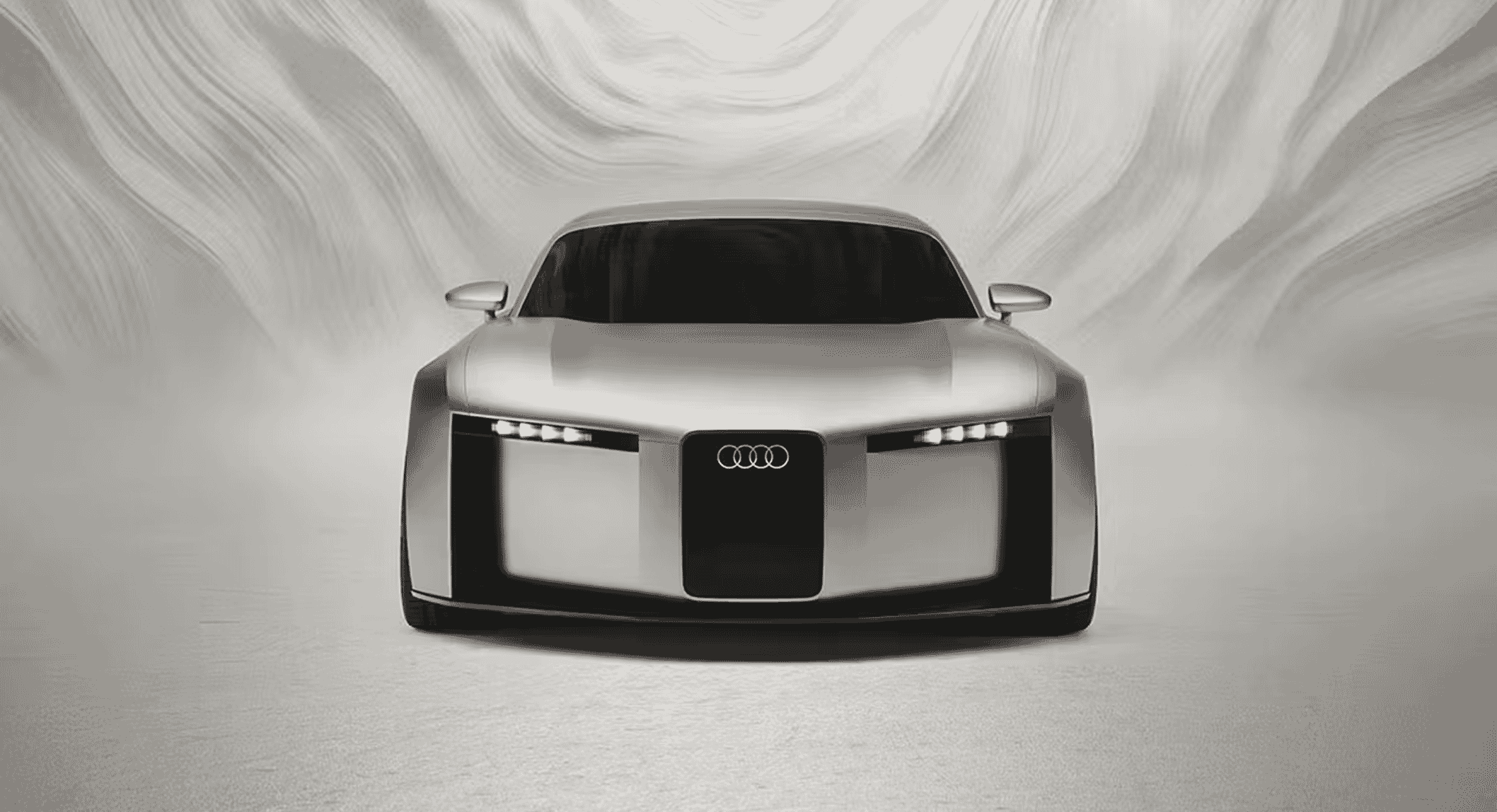Front view of the Audi Concept C showing sharp LED headlights and a streamlined body.