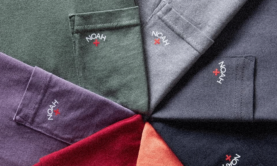 Top-down view of NOAH pocket t-shirts in multiple colors arranged in a circle.