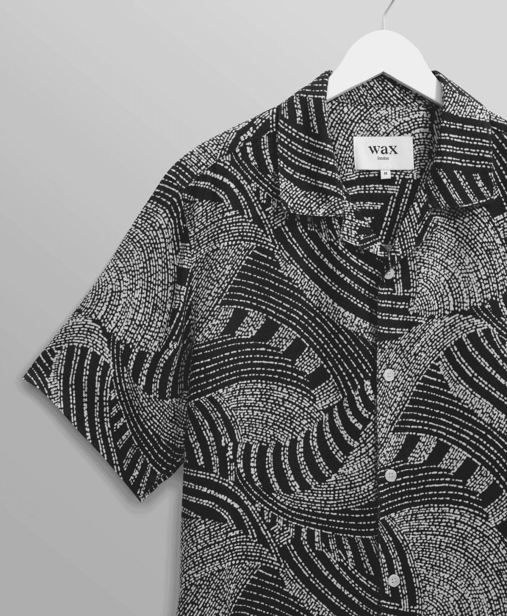 Wax London short-sleeve shirt featuring an abstract black-and-white dotted wave pattern.