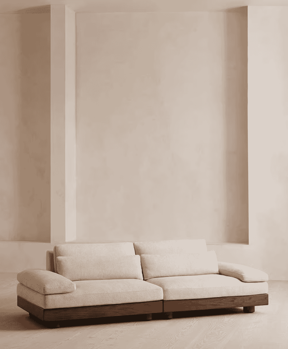 Light beige textured upholstery on a modular sofa with a dark wood base.