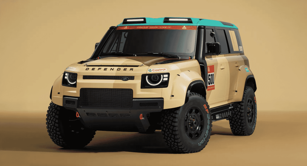Side profile of a beige Land Rover Defender rally concept with off-road tires and a teal roof.