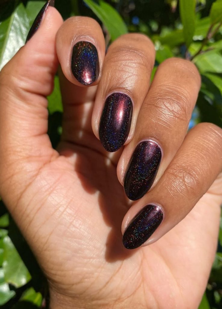 Deep cocoa brown almond-shaped nails with a high-gloss finish.