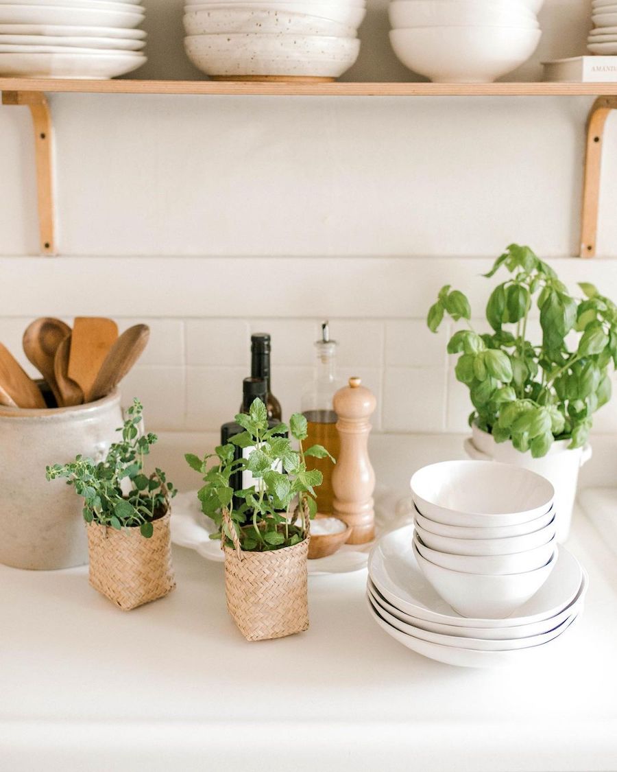 A group of friends gathered around an aesthetic outdoor table with spring floral arrangements.