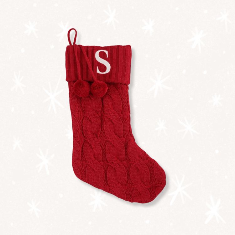 Vibrant red cable knit Christmas stocking.