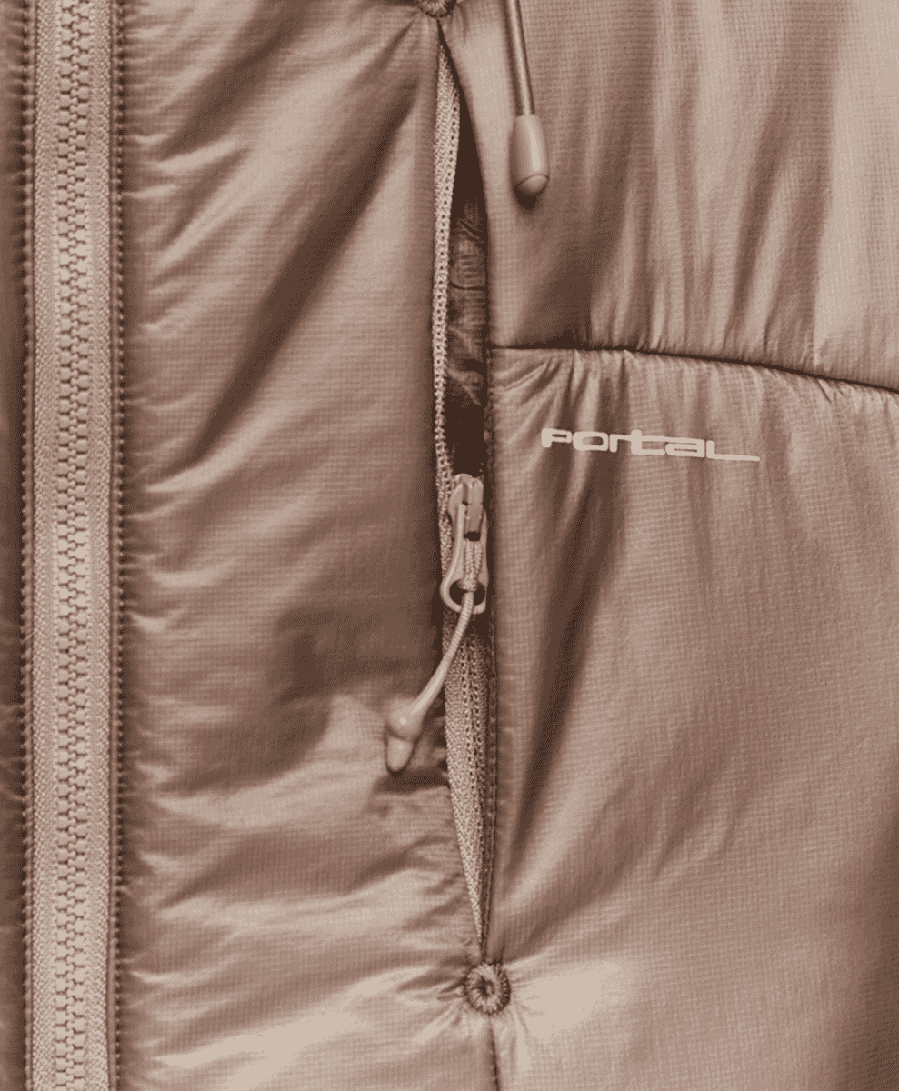 Close-up of a brown 'Portal' brand insulated jacket showing fabric weave and zipper detail.