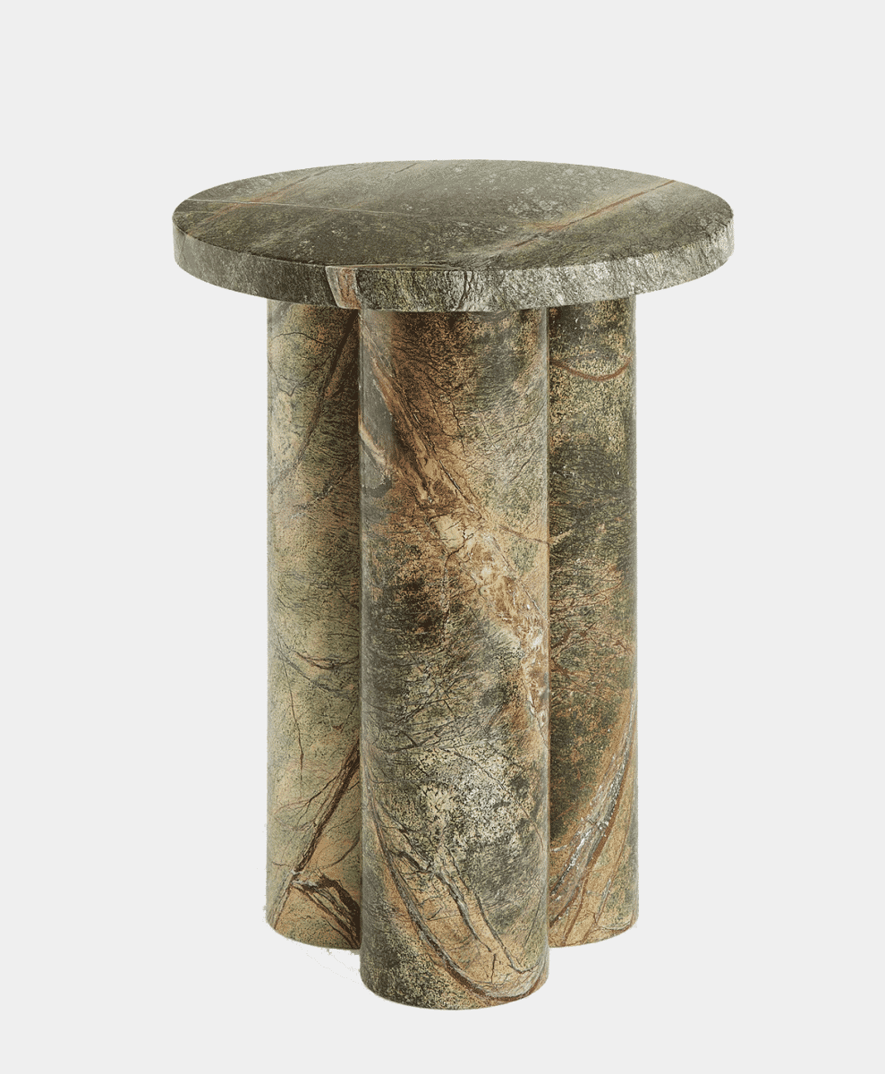 A round marble side table with three cylindrical legs featuring natural green and brown veining.