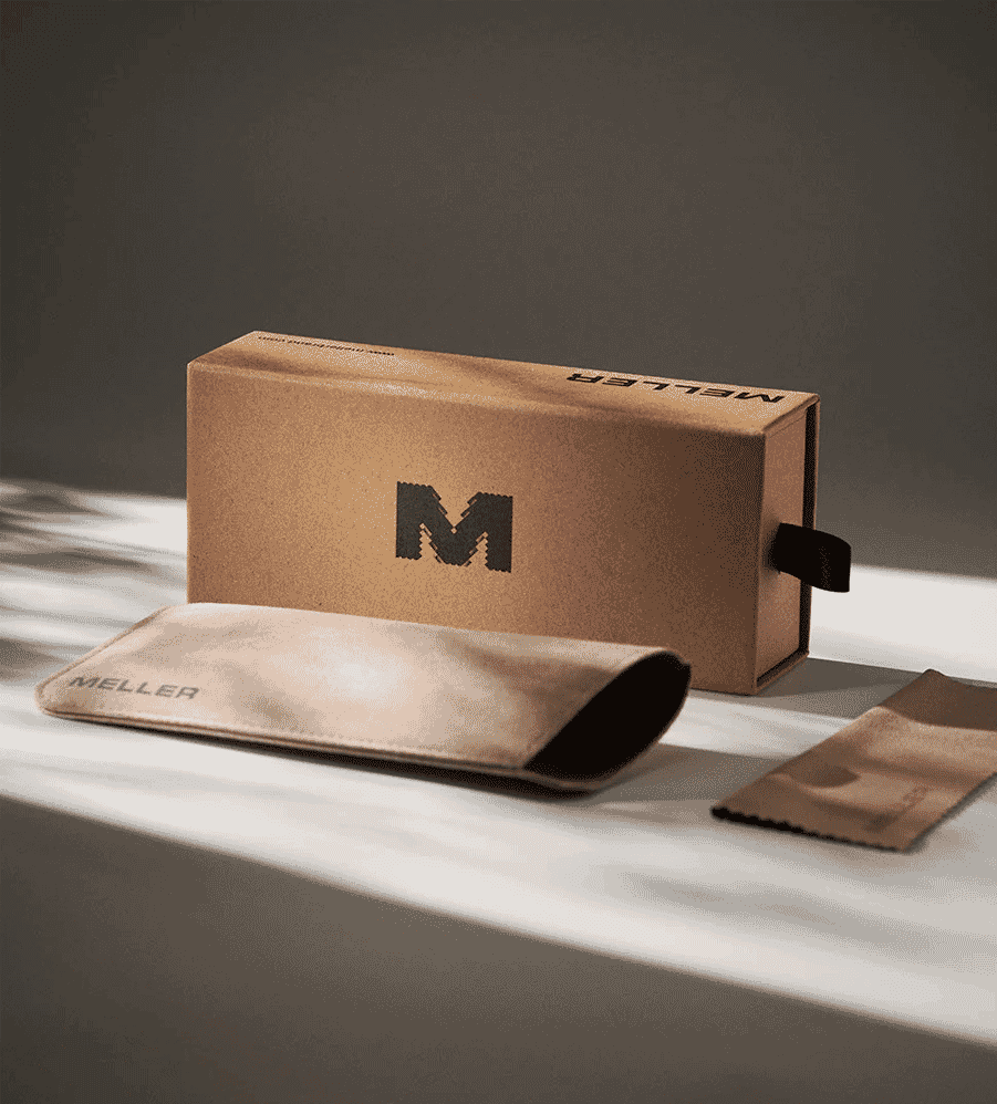MELLER luxury eyewear packaging including box, case, and cloth on a sunlit surface.