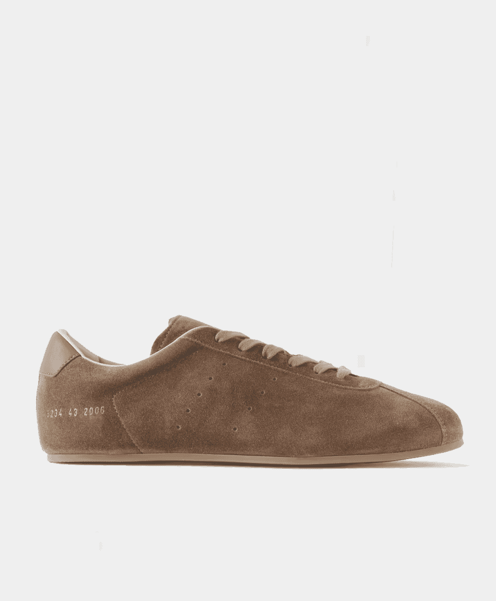 Side profile of a brown suede Common Projects Driving sneaker.