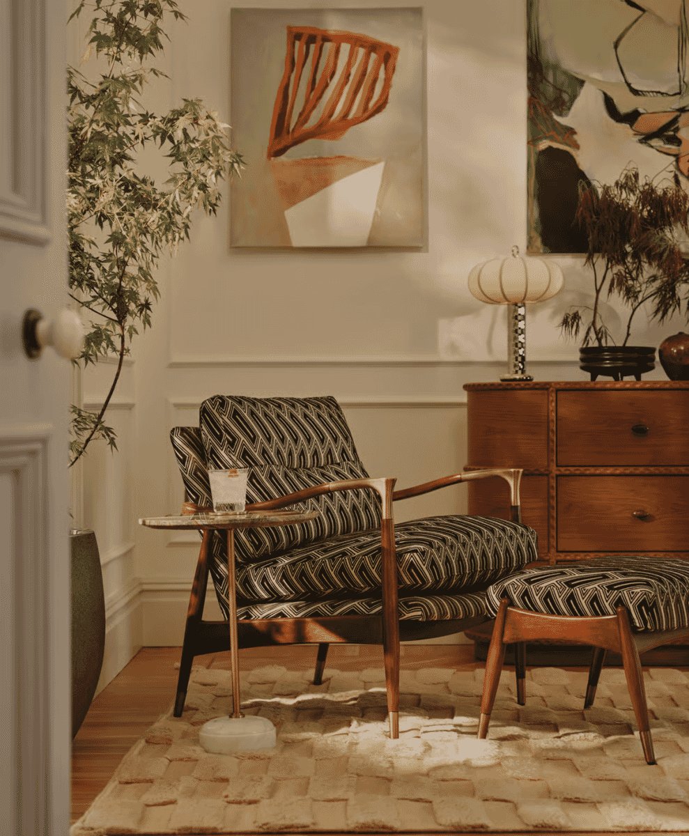A mid-century modern armchair with geometric upholstery in a stylish living room.