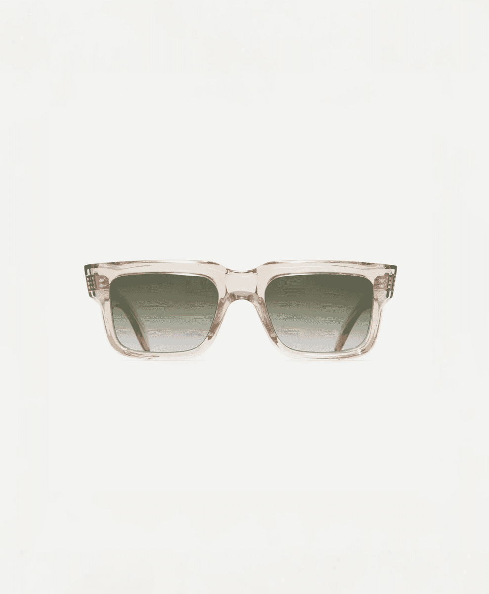 Transparent acetate-frame sunglasses with green lenses on a white background.