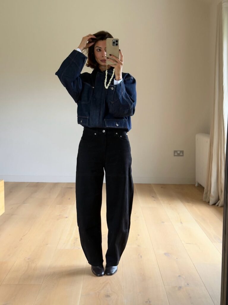 Full look featuring light wash barrel jeans and sharp black pointed heels