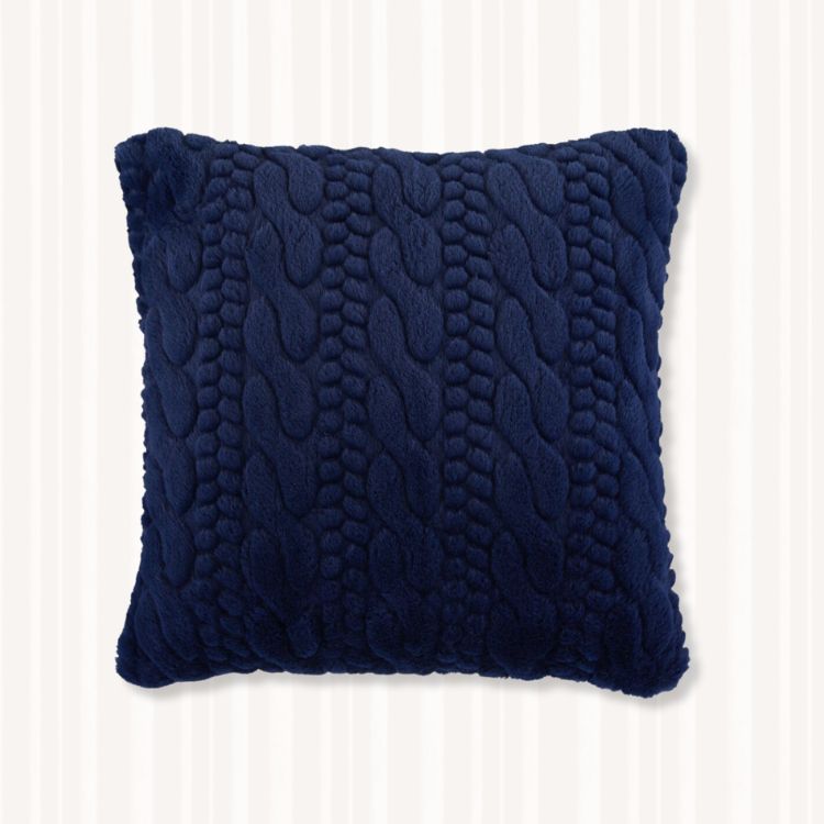 Solid navy blue throw pillow with a soft texture.