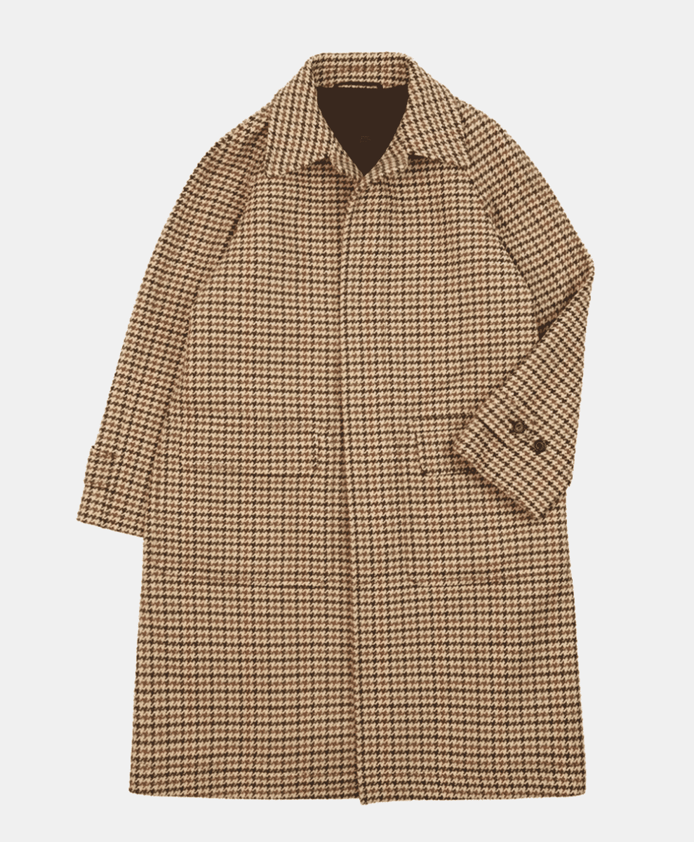 Houndstooth-patterned wool coat in beige and brown tones.