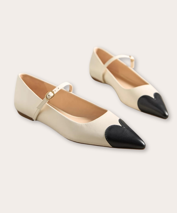 Mary Jane flats with a heart-shaped detail on the toe.