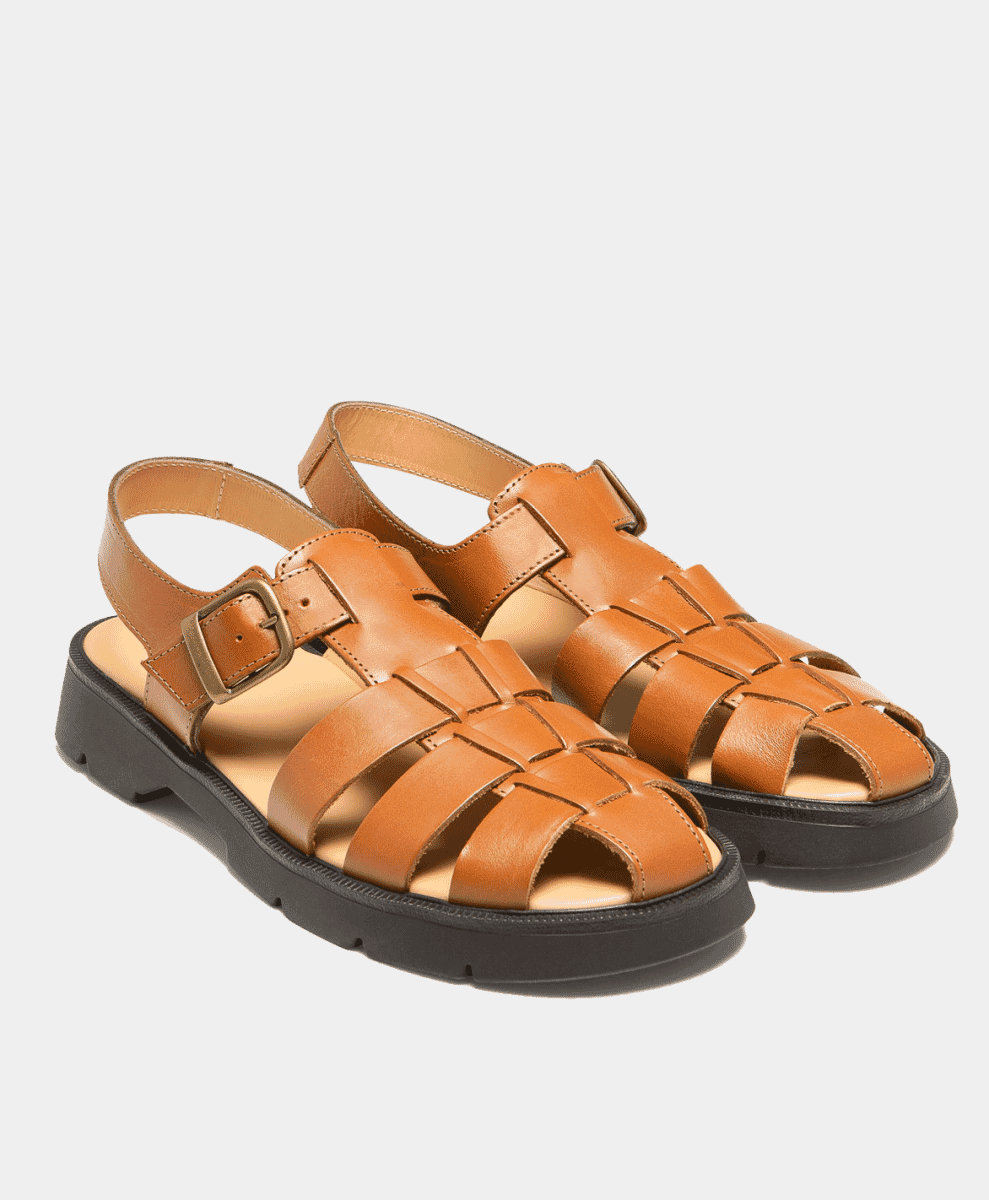 Caramel-colored fisherman sandals with woven leather straps and chunky soles