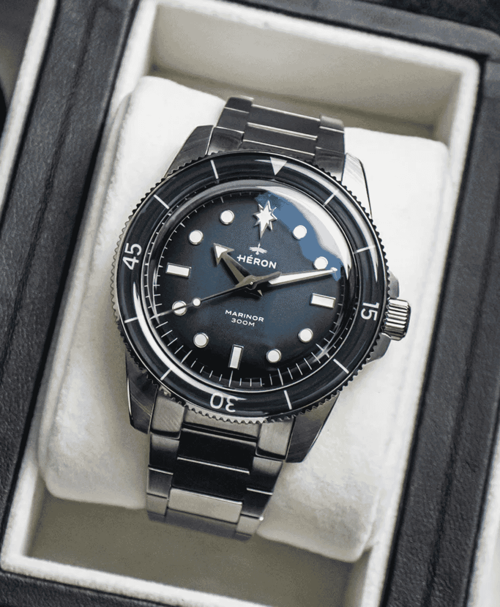 Heron Marinor dive watch with a black dial displayed inside its luxury storage box.