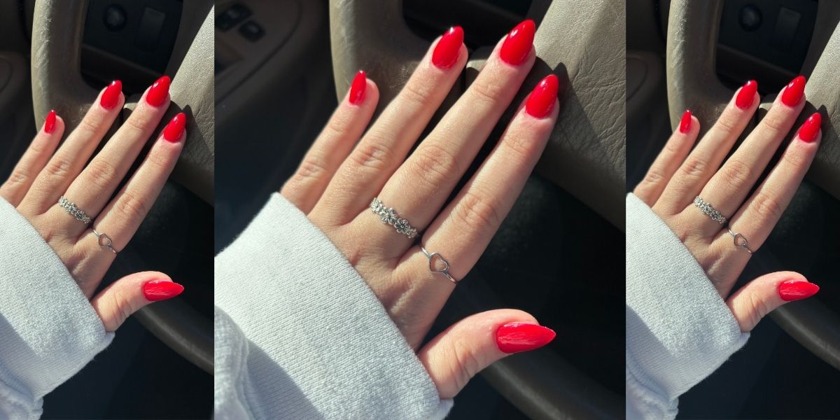 An array of OPI red nail polish bottles representing different shades.