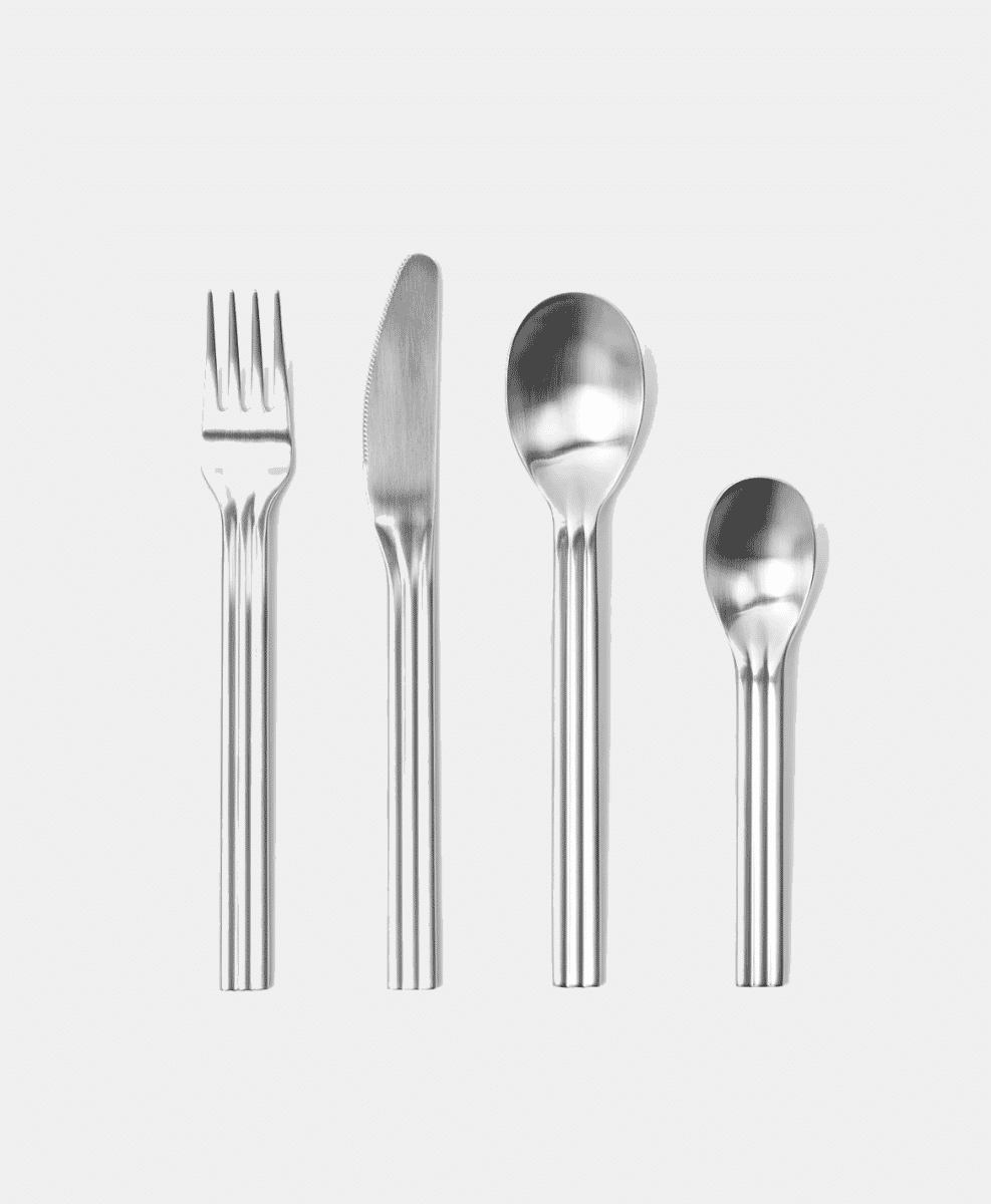 Four minimalist stainless steel dining utensils arranged vertically.