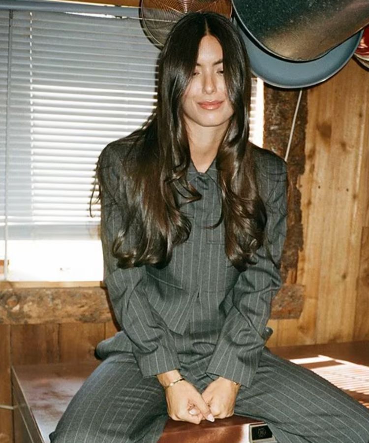 The Drew Stripe Cropped Blazer featuring a sharp pinstripe pattern.