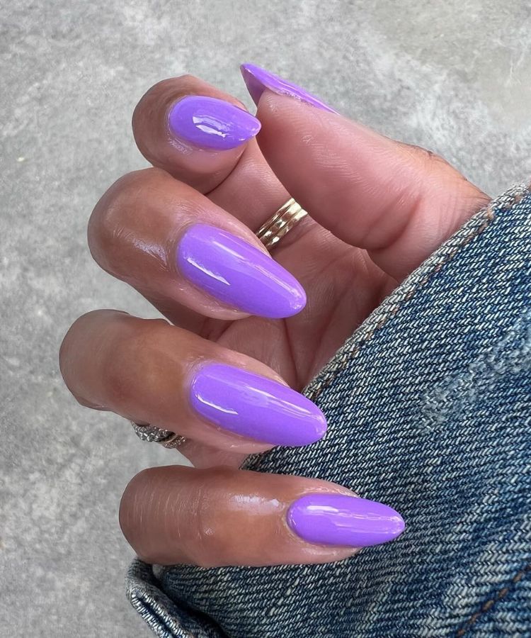 A vibrant coral-toned popsicle manicure with a translucent, glassy texture.