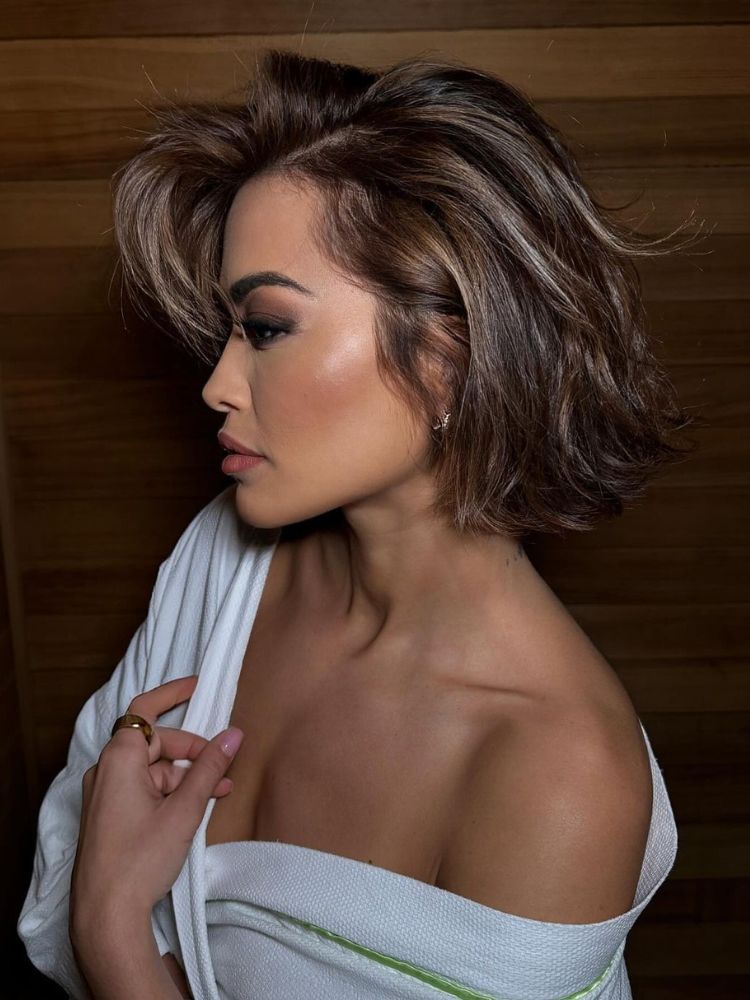 Rita Ora showcasing a dimensional hazelnut brunette bob.