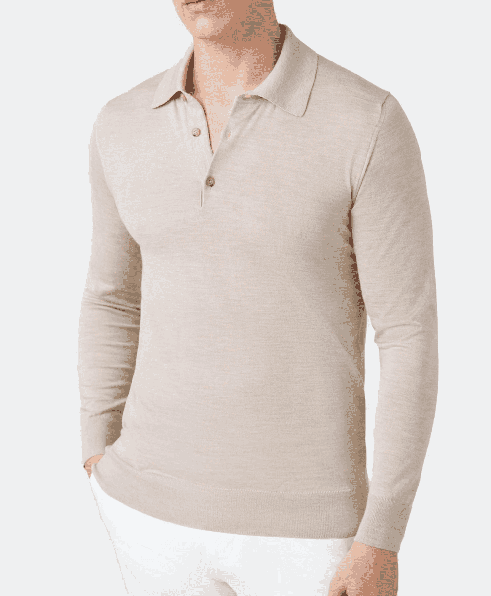 A man models a light beige long-sleeve knitted polo shirt against a minimalist background.