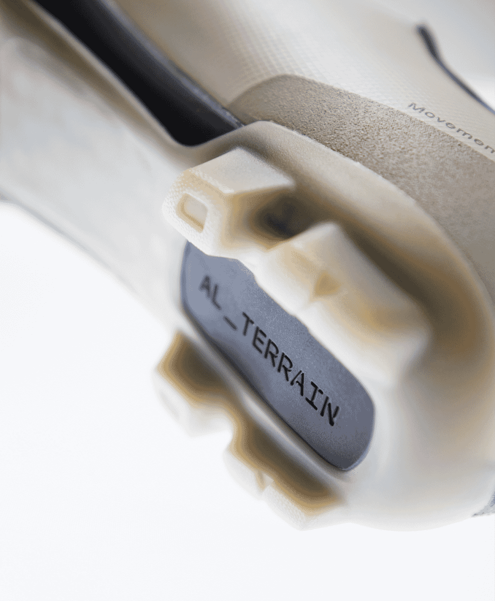 Close-up shot of the AL_TERRAIN cleat system on the sole of the MAAP x QUOC shoe.