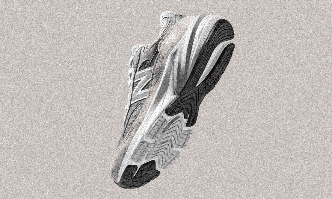 Stylized monochrome New Balance running shoe highlighting its chunky design and dark outsole.