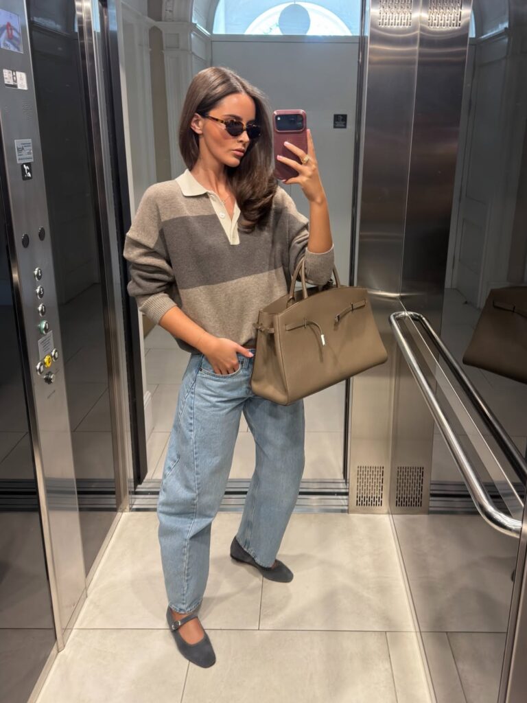 Confident woman walking in well-styled barrel leg jeans and chic flats