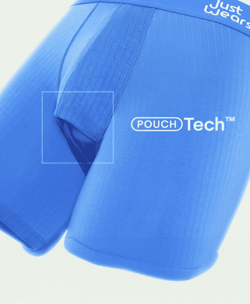 Macro shot of blue JustWears boxer briefs highlighting the POUCH Tech logo and ergonomic stitching.