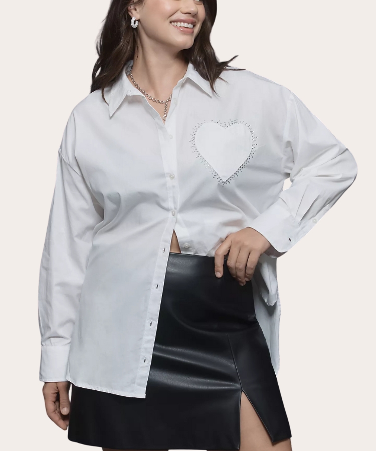 A pink button-down shirt featuring a red heart-shaped pocket.