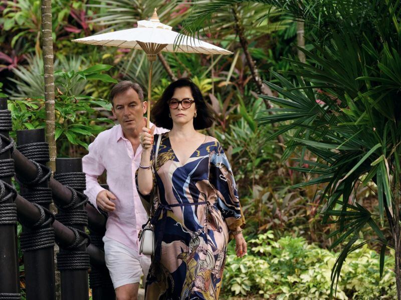 Character from The White Lotus in resort wear