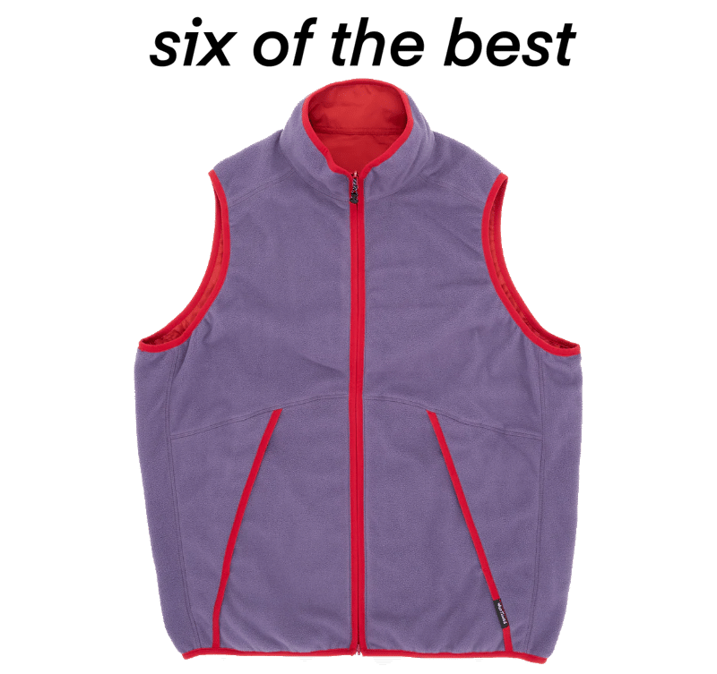 Purple fleece vest with red trim details.