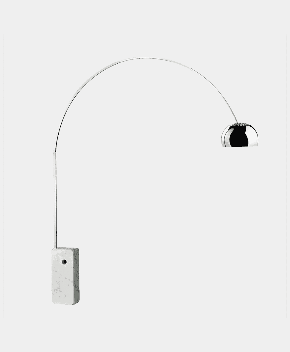 The Flos Arco floor lamp showcasing its distinctive curved chrome arm and solid Carrara marble base.