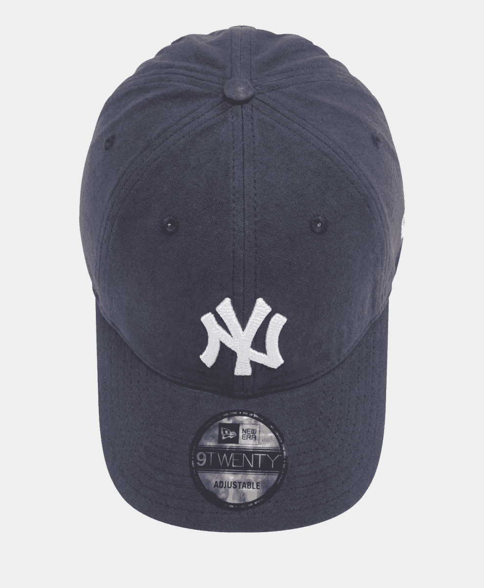 Close-up of the New Era 9Twenty navy cap showing stitching details.